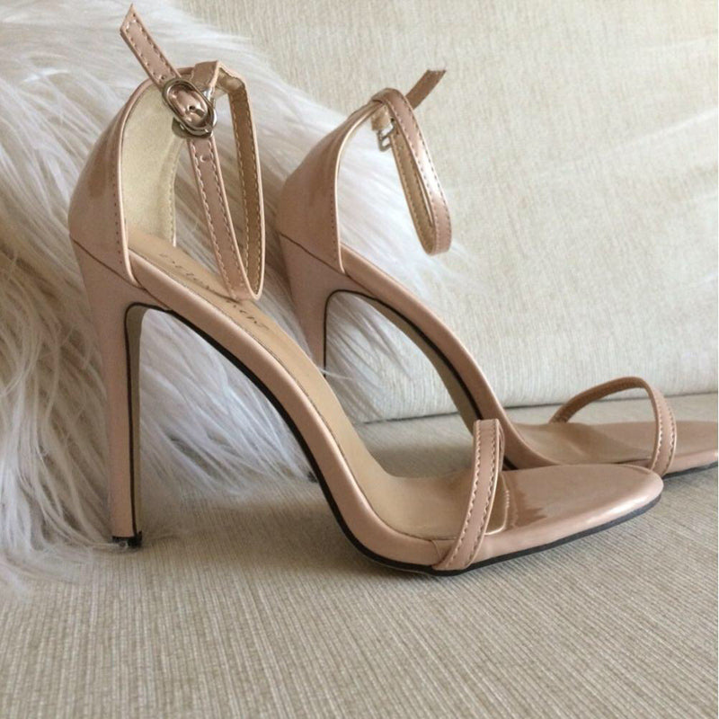 Red Room Barely-There Stilettos glossy apricot pair in angled side view