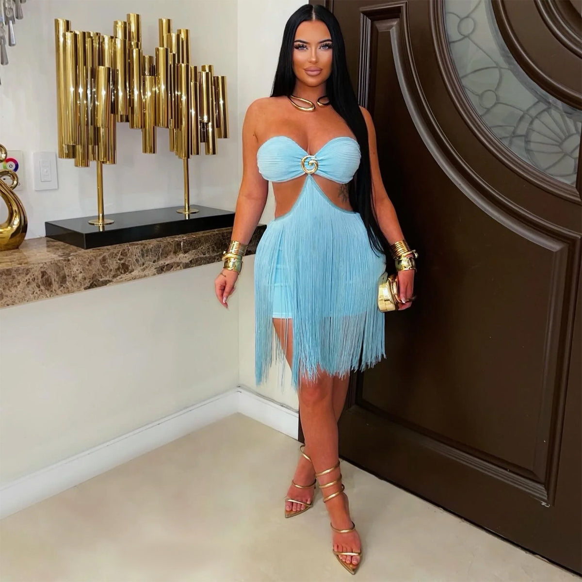 Adult model wearing the blue Fringe Benefits Mini Dress in a full-length indoor lifestyle front view.