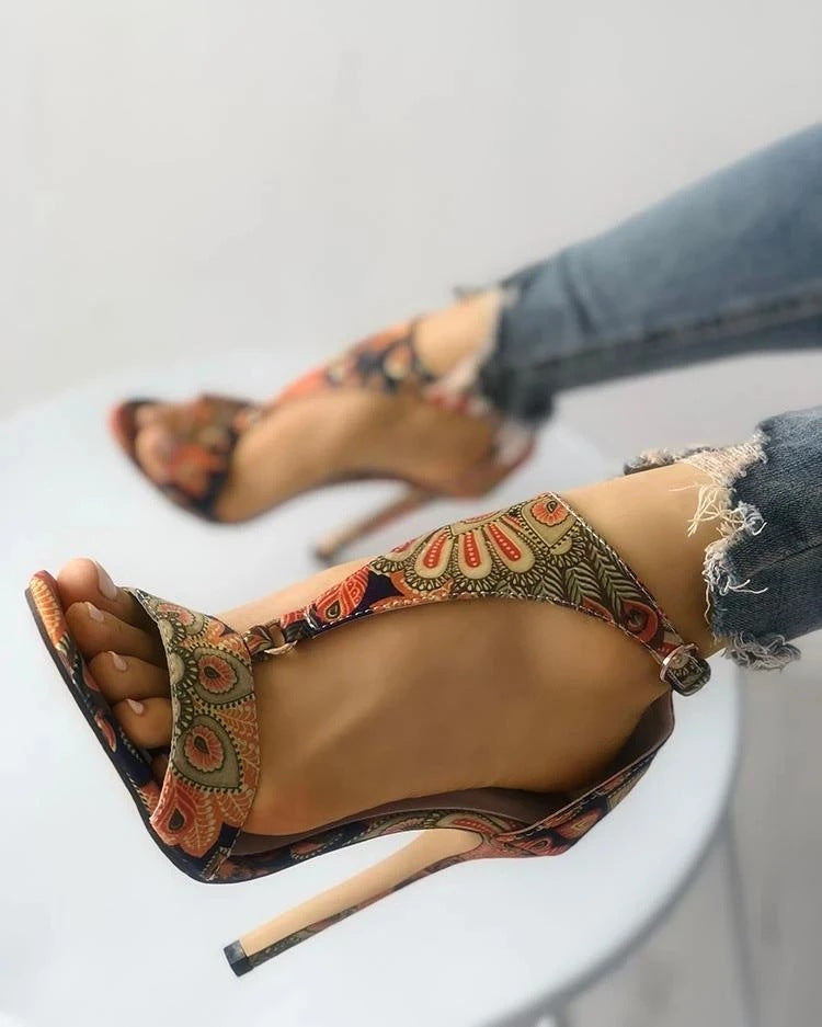 Golden Hour Print Stiletto Sandals supplier reference view 4 showing bronze multicolor ornate-print open-toe sandals with ankle straps and slim stiletto heels