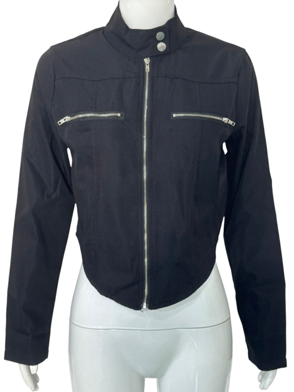 Front view of the black cropped zip jacket on a white mannequin, showing the snap collar and silver-tone zippers.