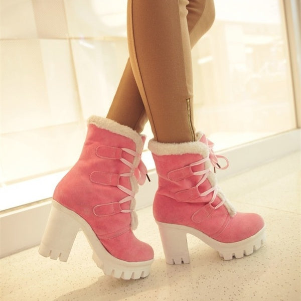 Pink Cold Front Plush Heel Boots worn side view showing white plush trim and lug sole