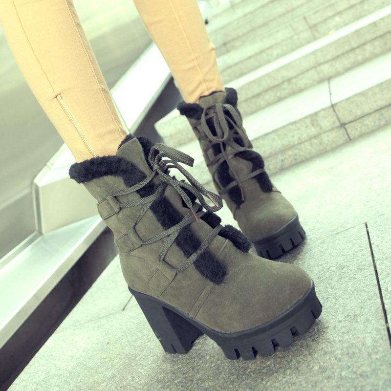 Army Green Cold Front Plush Heel Boots worn close up with black plush trim and lug sole