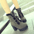 Army Green Cold Front Plush Heel Boots worn close up with black plush trim and lug sole