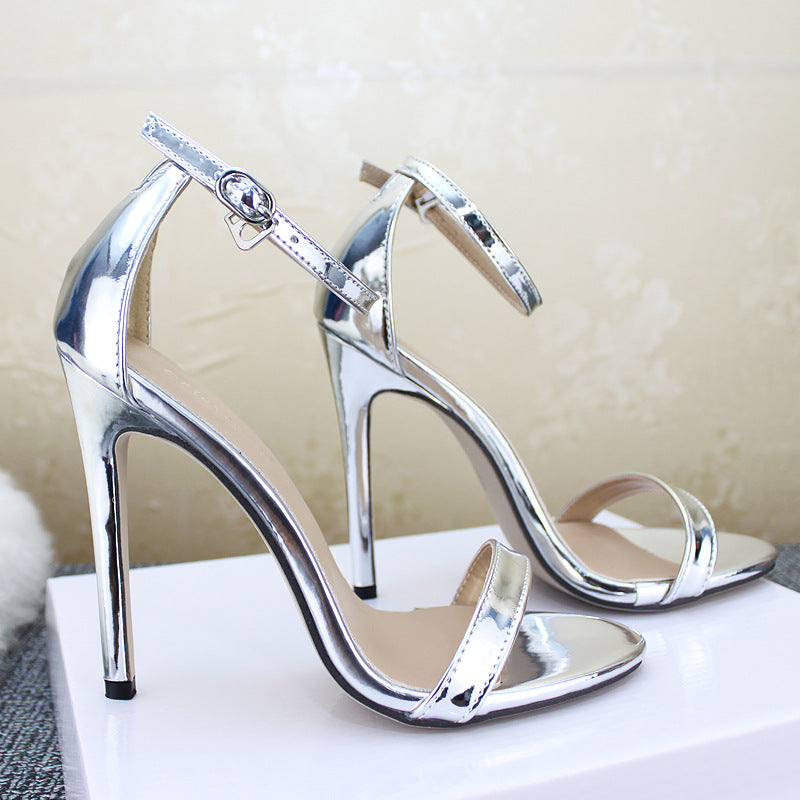 Pair of silver Liquid Metal Stiletto Sandals with toe bands and ankle buckles
