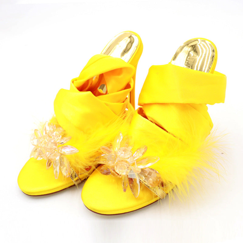 Golden Hour yellow cross-strap stiletto heels, product-only paired low front three-quarter view
