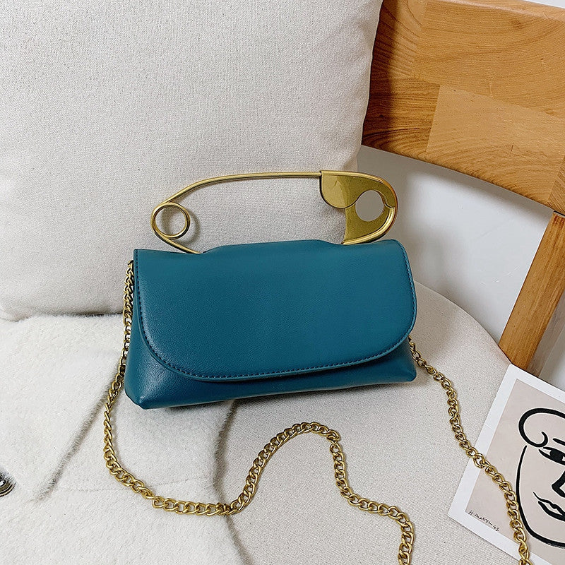 Blue Power Move Top-Handle Bag with gold-tone handle and chain strap, front view