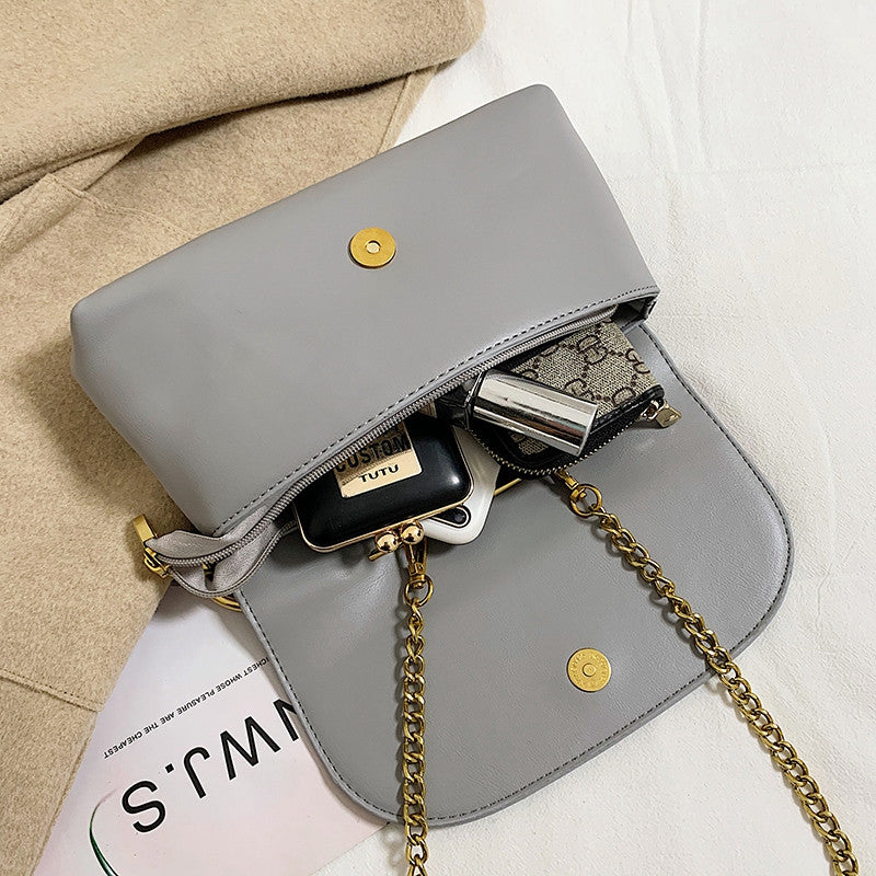 Open grey Power Move Top-Handle Bag showing the main compartment and magnetic flap