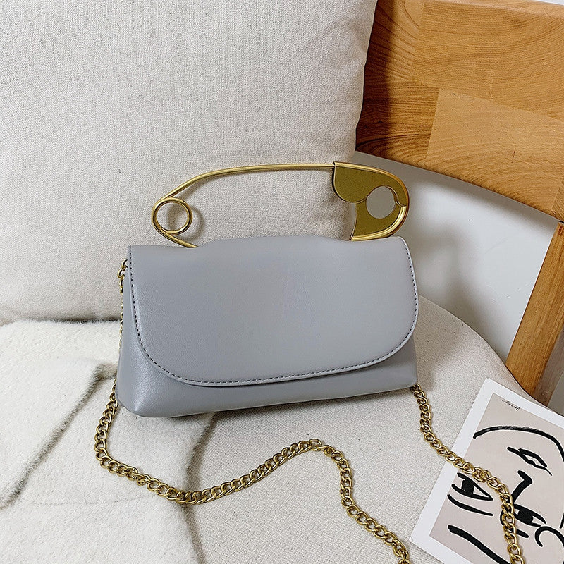 Grey Power Move Top-Handle Bag with gold-tone handle and chain strap, front view