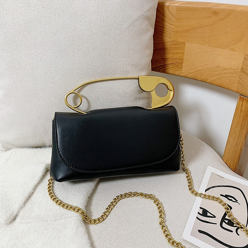 Black Power Move Top-Handle Bag with gold-tone handle and chain strap, front view