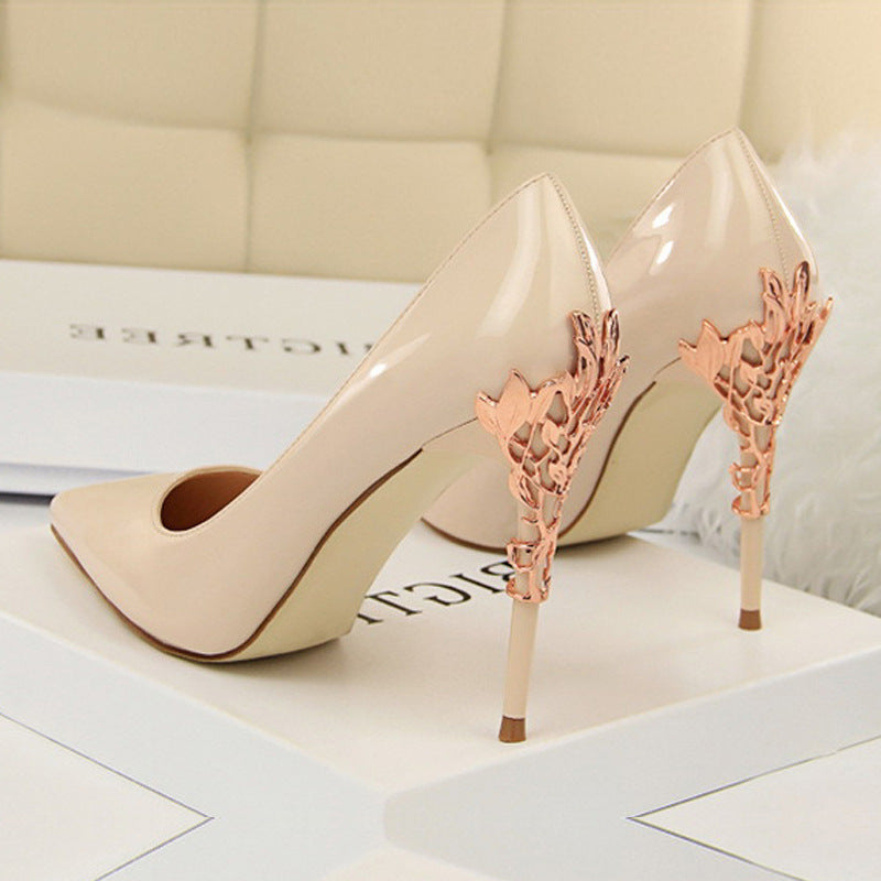 Champagne Boardroom Pointed Stiletto Heels rear three-quarter view with rose-gold filigree heel detail
