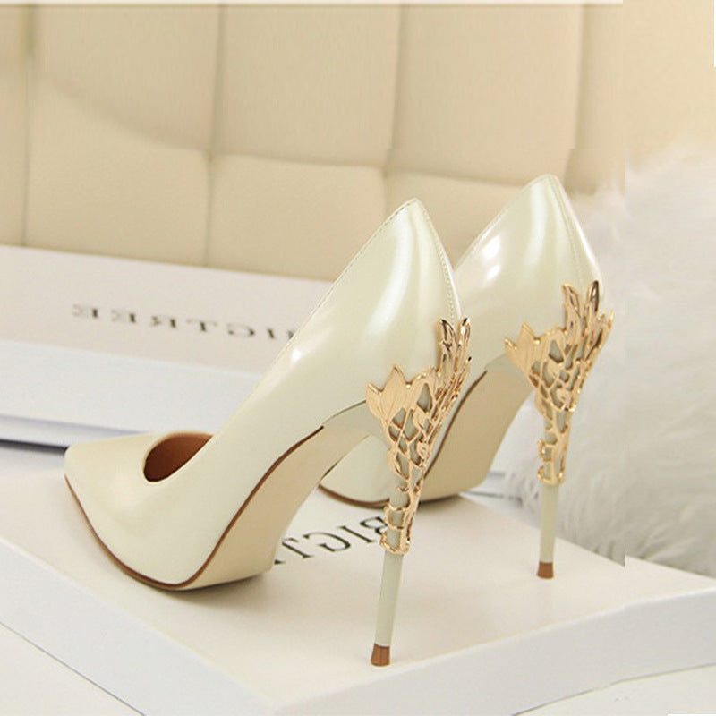 White Boardroom Pointed Stiletto Heels rear three-quarter view with gold filigree heel detail
