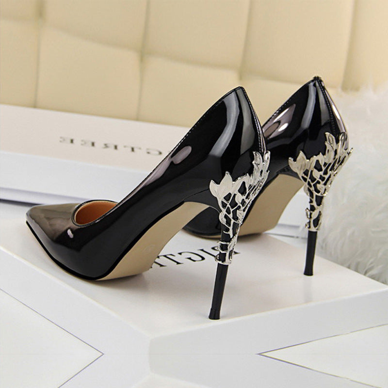 Black Boardroom Pointed Stiletto Heels rear three-quarter view with silver filigree heel detail