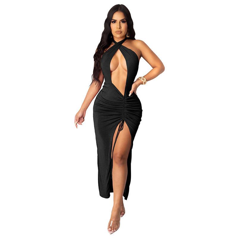 Full front view of an adult model wearing the black halter cutout maxi dress with ruched drawstring slit.
