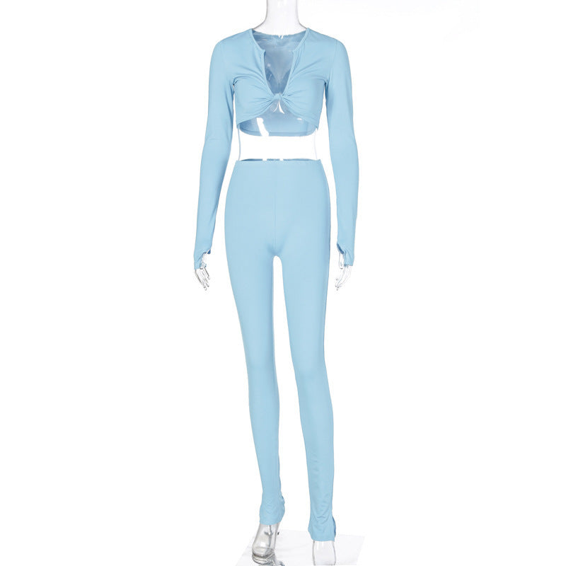 Blue long-sleeve crop top and matching fitted jogger pants shown on a transparent mannequin.