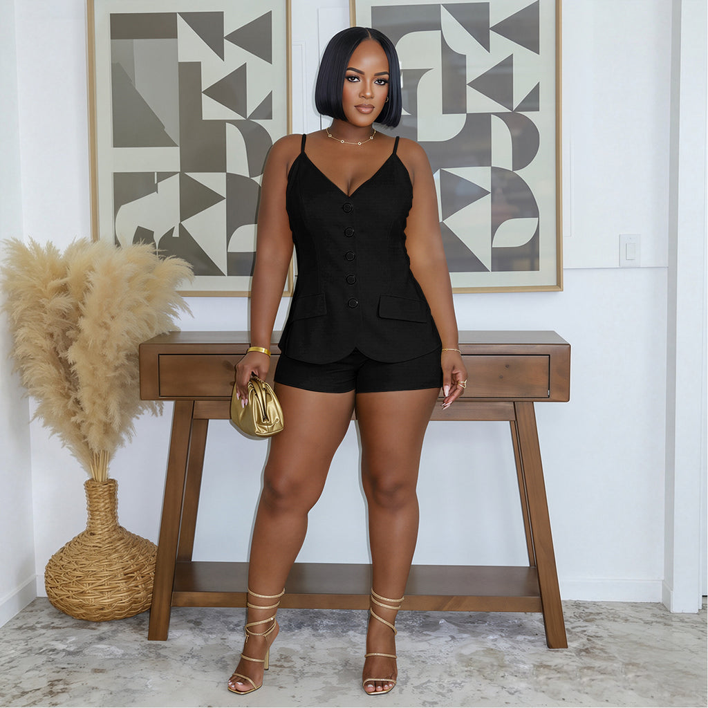 Model wearing black Boardroom Heat sleeveless button-front top and matching shorts, front view