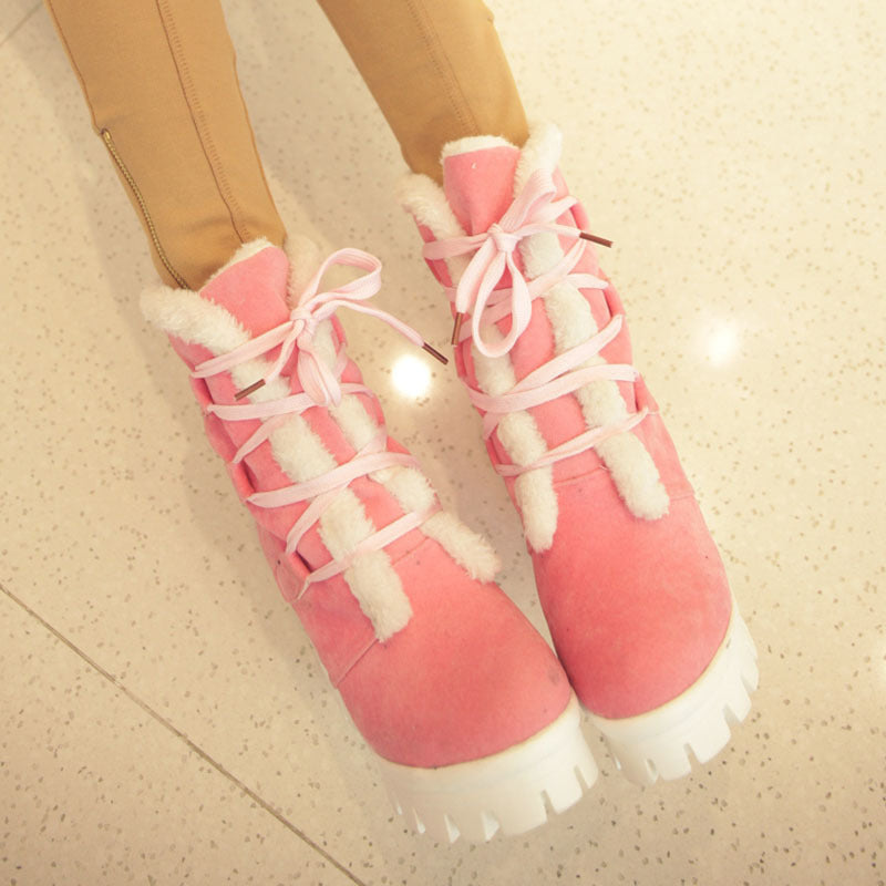 Pink Cold Front Plush Heel Boots worn front view showing lace-up construction and plush channels