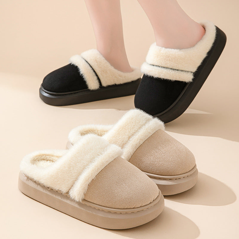 Black platform slippers worn on feet with beige slippers displayed in front.