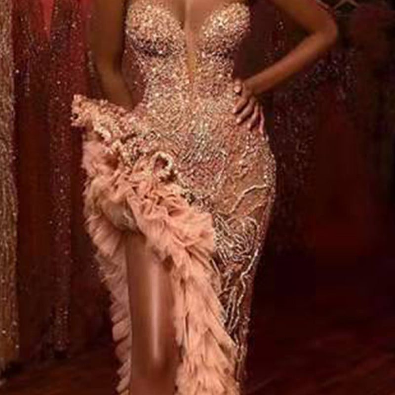 Three-quarter view of Champagne Drama Sequin Gown showing champagne sequins and blush feather cascade