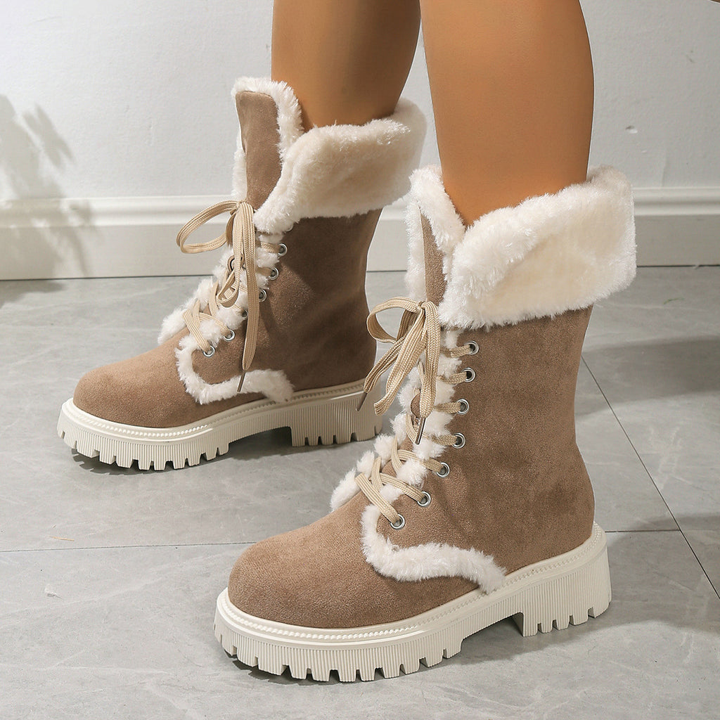 Adult model wearing brown Frost Kiss Lace-Up Boots, angled side-front view.