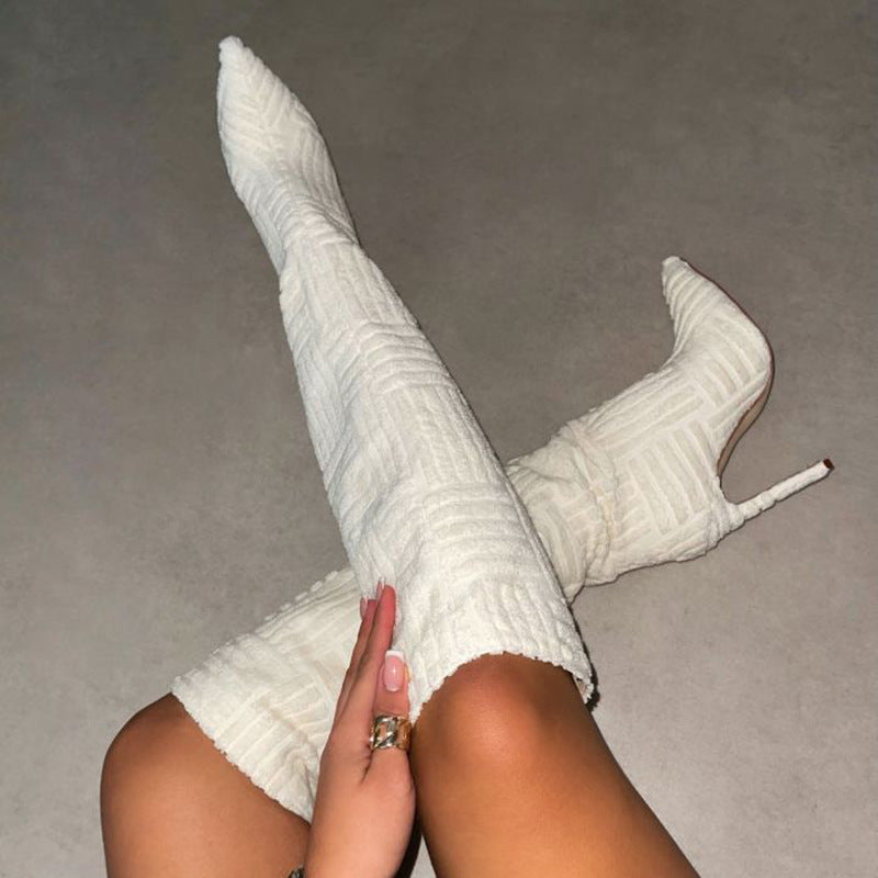 White Main Character Suede Stiletto Boots worn crossed-leg view