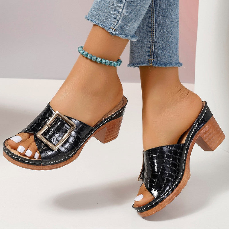 Black croc-textured buckle slides shown from the front and rear-side view.