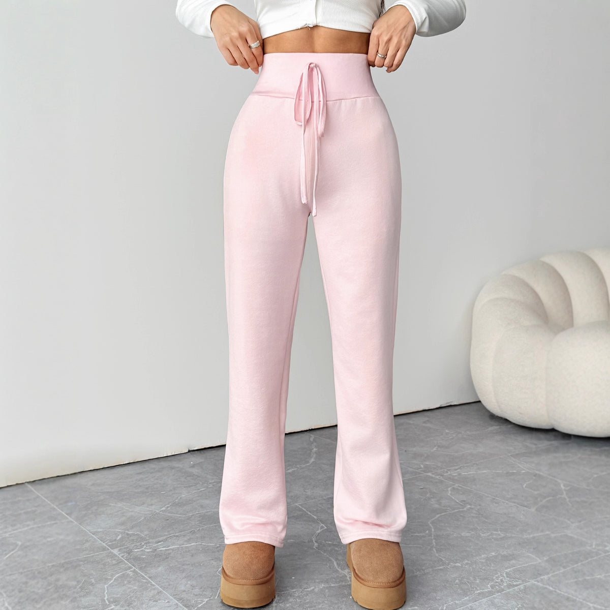 Pink Power Pants front view with broad waistband and straight legs
