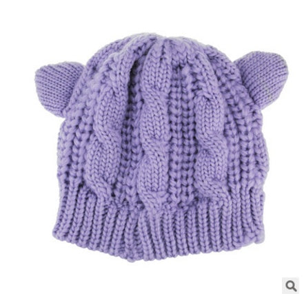 Kitty Club purple cat-ear cable-knit beanie on a model