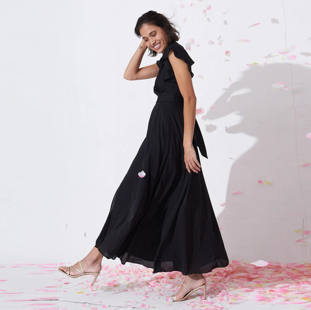 Petal Waltz black tie-waist maxi dress with flutter sleeves, side-front view
