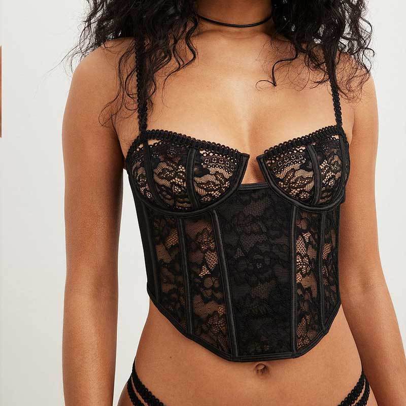 Adult model wearing the black lace corset bra, front view