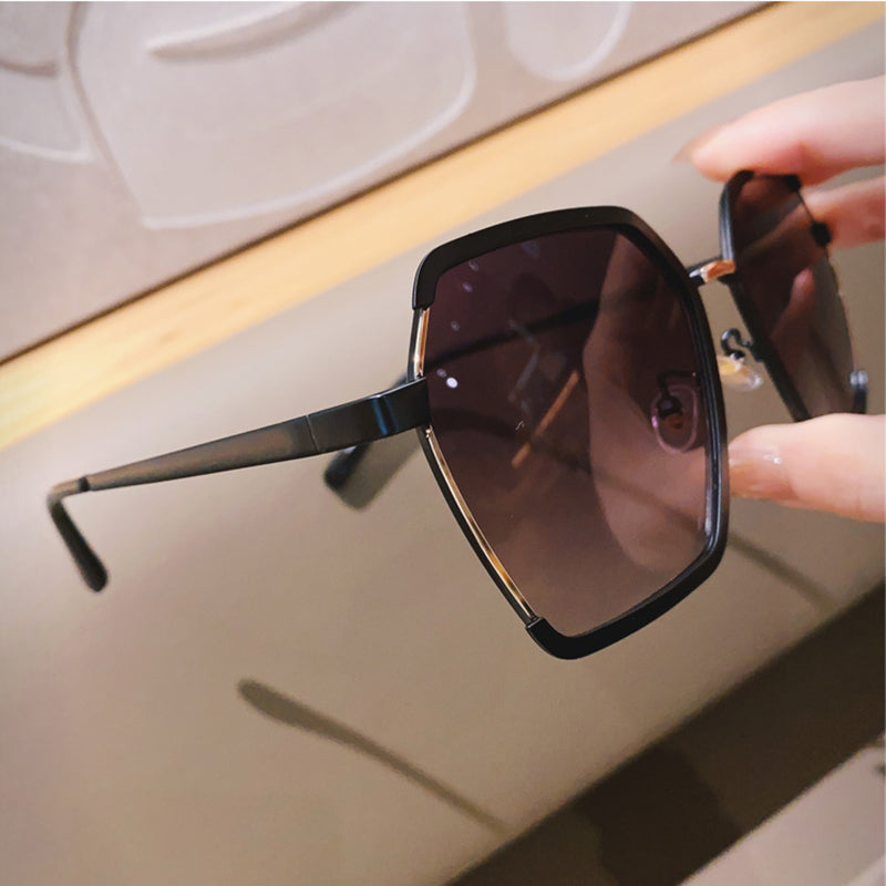 Top Floor Energy oversized metal half-frame sunglasses close-up