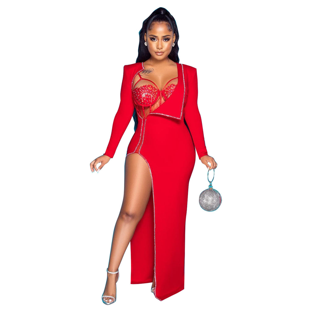 Model wearing the red Billion Moves Maxi Dress with long sleeves, jeweled lace bodice, high slit, and draped collar, holding a silver handbag.