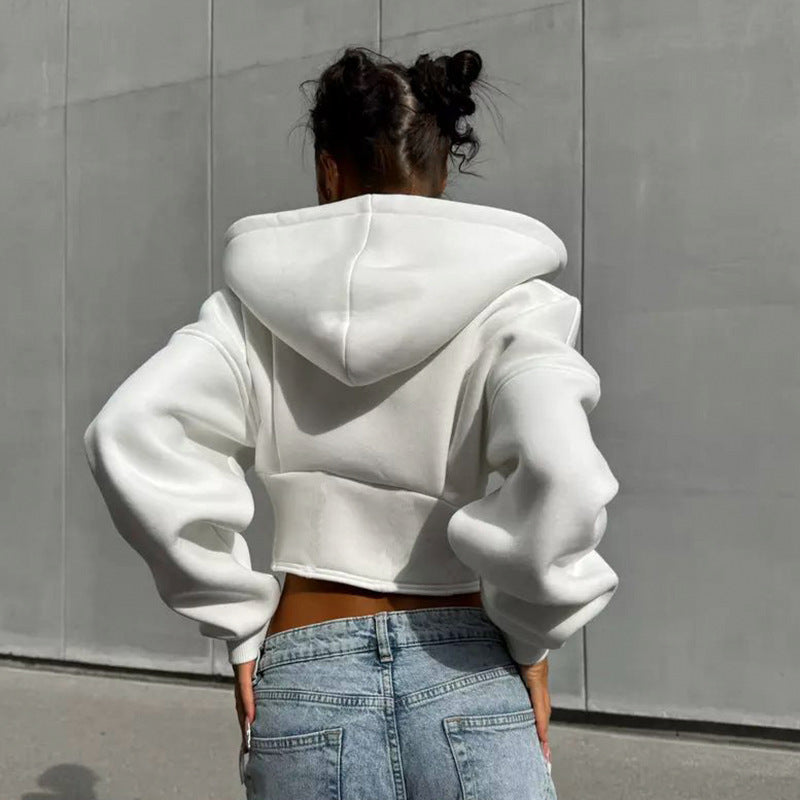 Adult model wearing the white corset-style zip hoodie, rear view showing the attached hood.