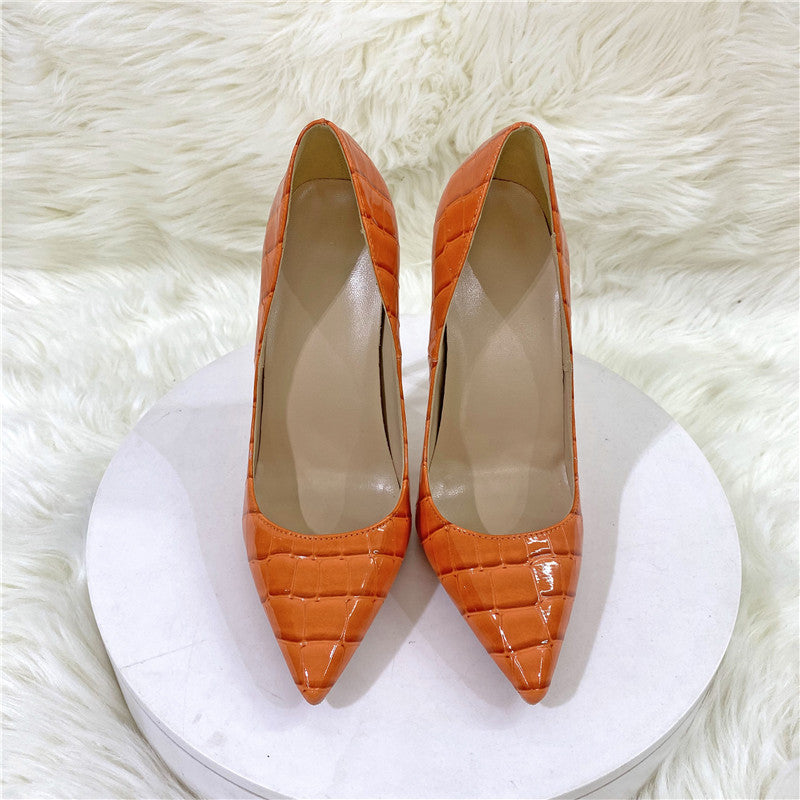 Orange embossed pointed stiletto pumps front view
