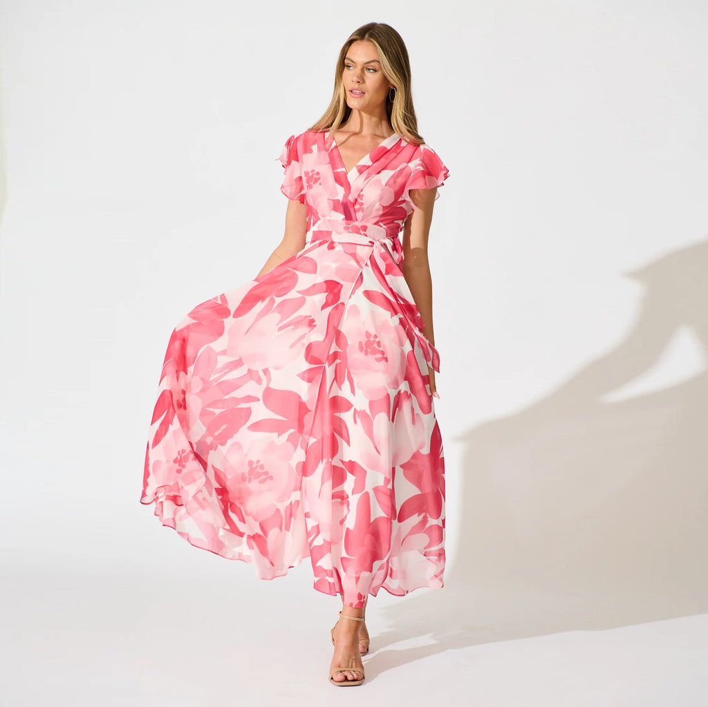 Petal Waltz peach botanical maxi dress with flutter sleeves and flowing A-line skirt