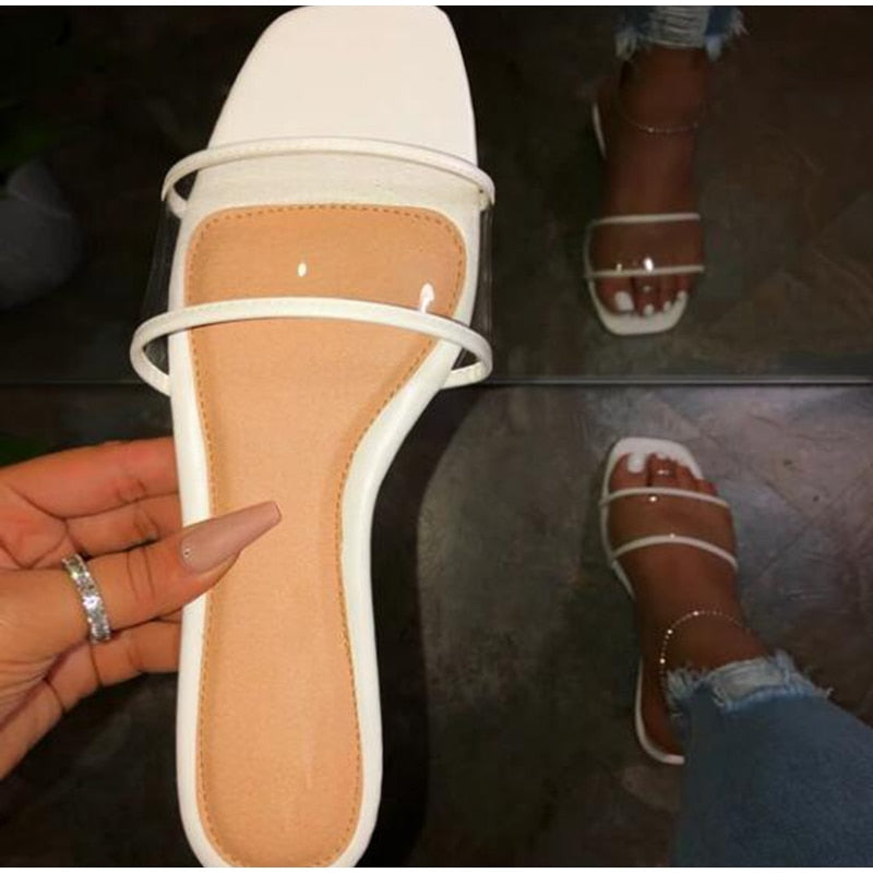 Clear Intent white square-toe slide with tan footbed, clear vamp band, and slim white toe strap