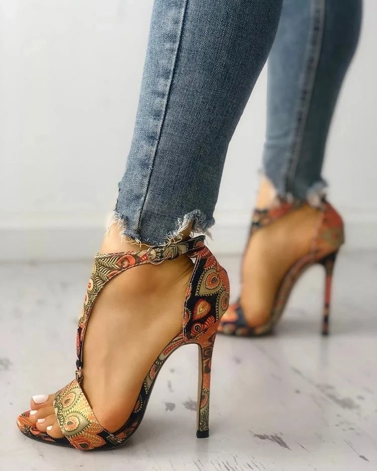 Golden Hour Print Stiletto Sandals supplier reference view 5 showing bronze multicolor ornate-print open-toe sandals with ankle straps and slim stiletto heels