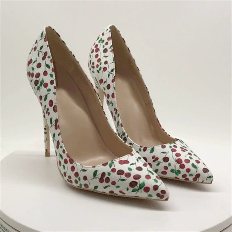 White cherry-print stiletto pumps front product view