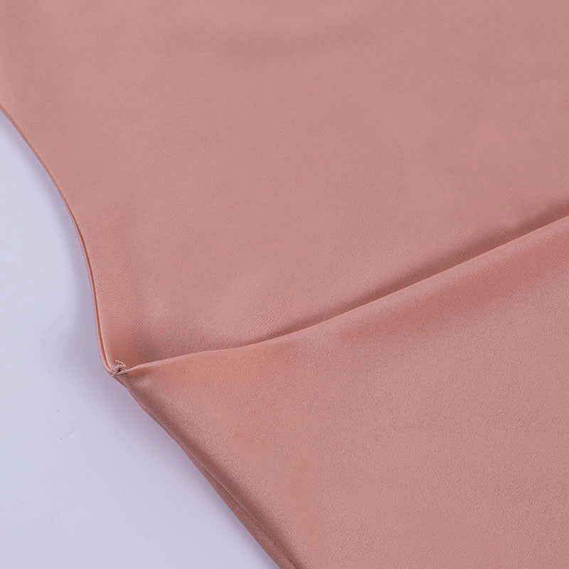 Close-up of the pink satin cowl neckline and side seam on the Champagne Hour mini dress