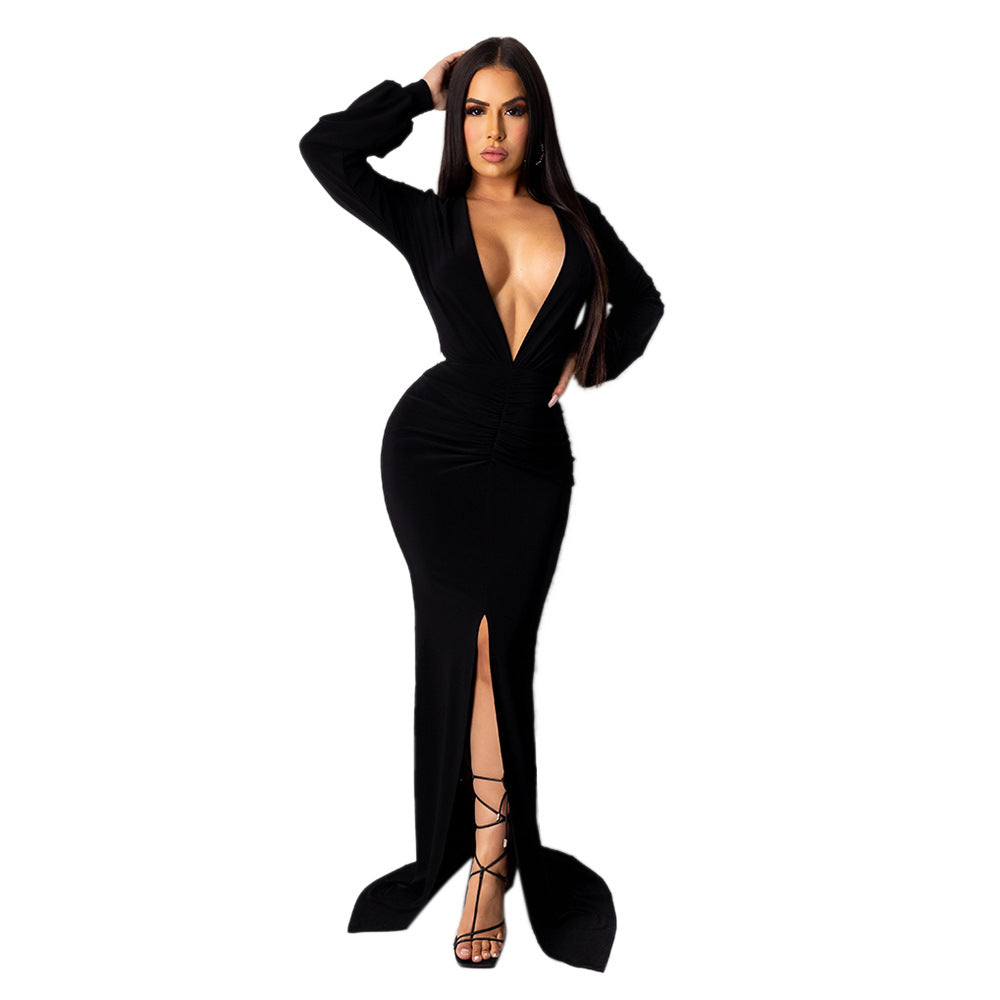 Full-length front view of an adult model wearing the black Spotlight Status Plunge Maxi Dress.