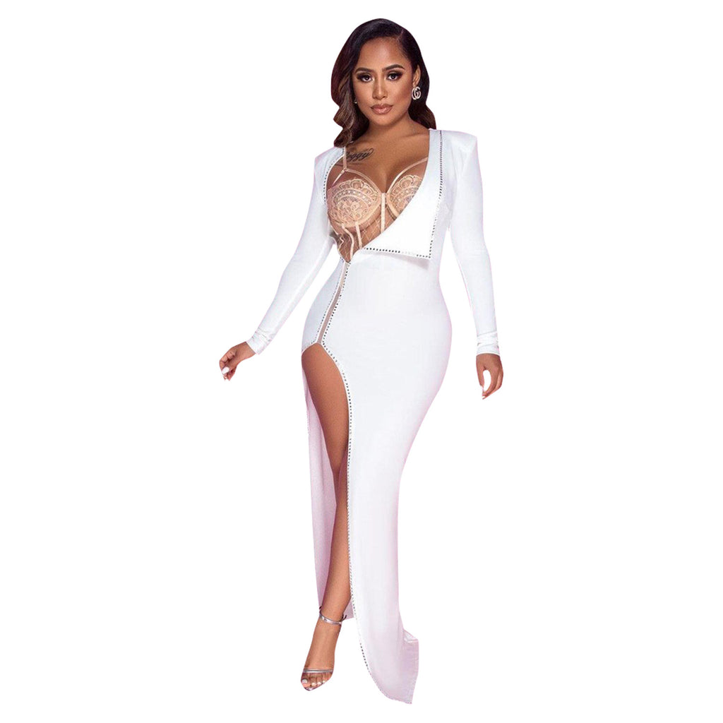 Front view of a model wearing the white Billion Moves Maxi Dress with long sleeves, jeweled cutout bodice, and high thigh slit on a white background.