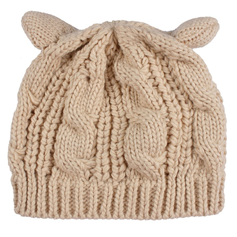 Kitty Club beige cat-ear cable-knit beanie on white background