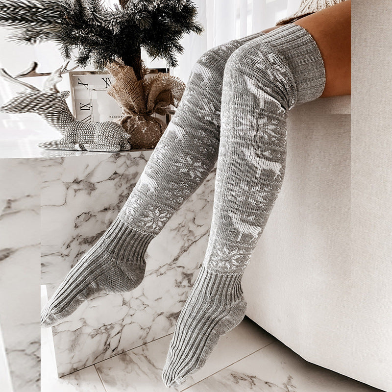 Gray holiday over-the-knee stockings showing the ribbed feet, cuffs and knit pattern.