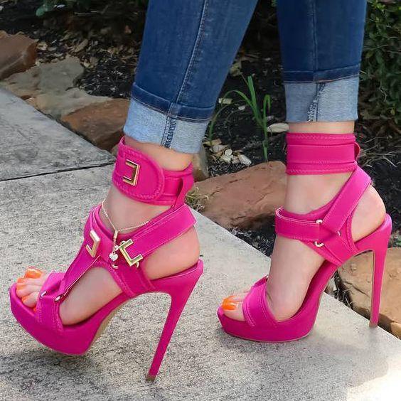 Rose red buckle platform sandals worn close up