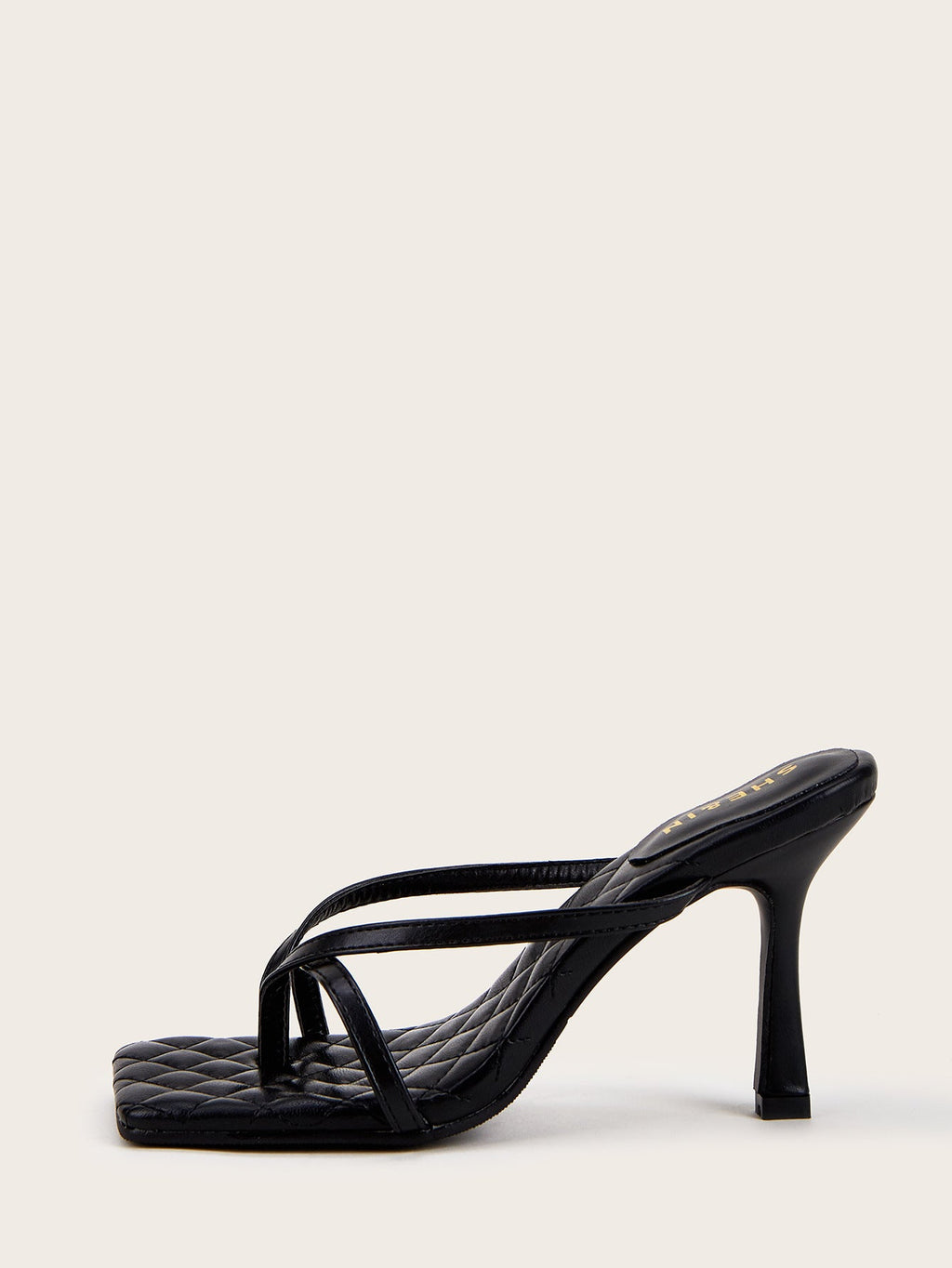 Black sculpted strap mule heel side profile with quilted footbed