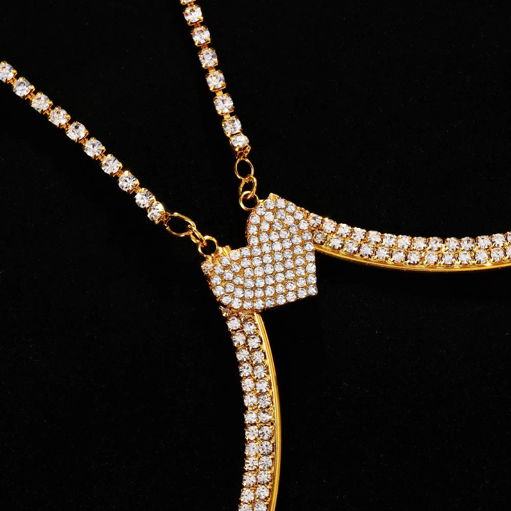 Gold Diamond Detail Body Chain close-up showing the pavé crystal heart and rhinestone arc connections