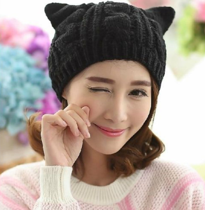 Kitty Club black cat-ear cable-knit beanie on a model