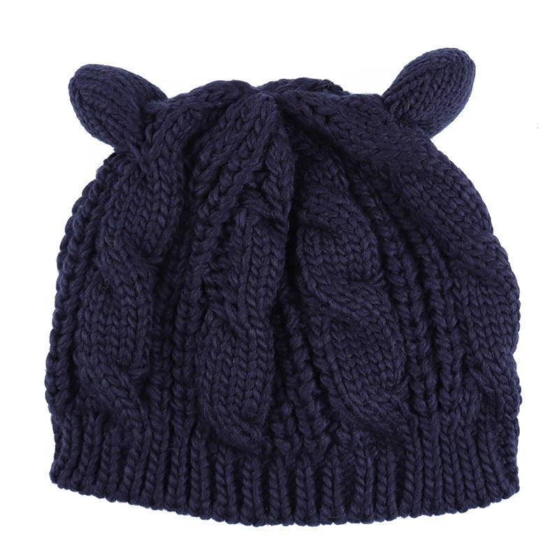 Kitty Club dark blue cat-ear cable-knit beanie on white background