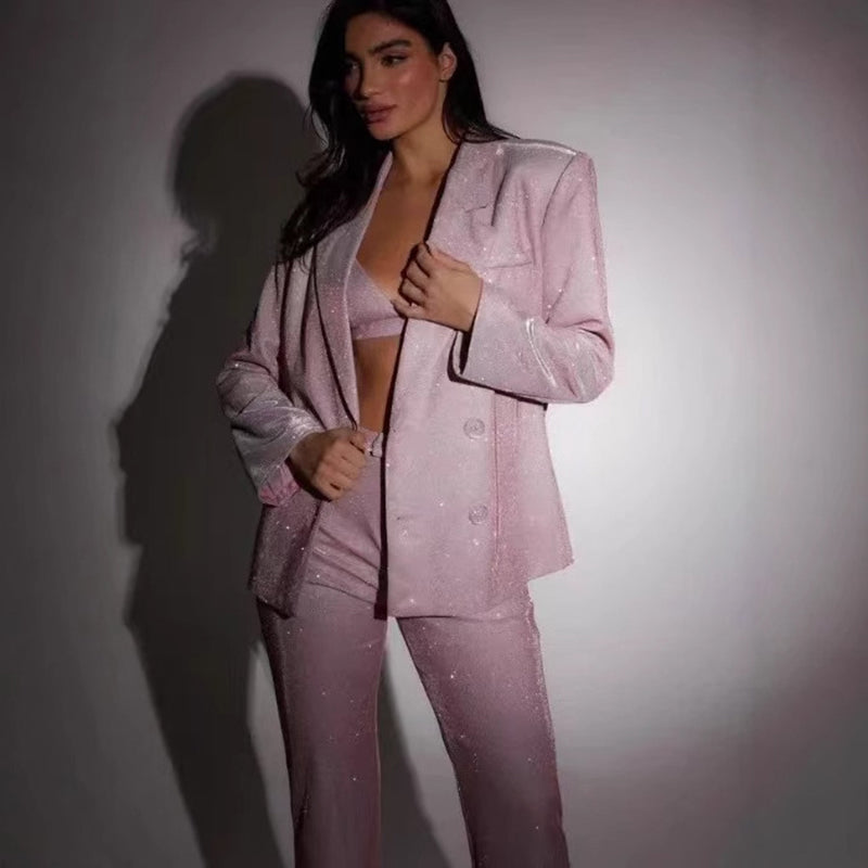 Adult model wearing the pink sequin bra, matching tailored jacket, and trousers set, front view.