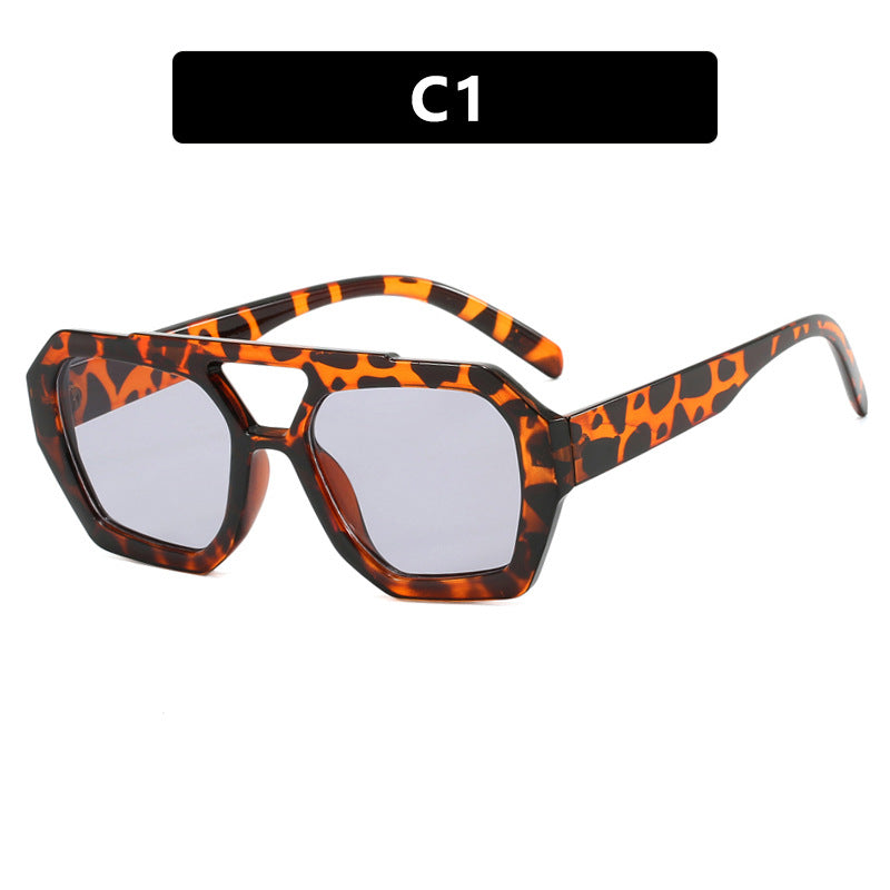 Orange tortoiseshell oversized sunglasses with light gray lenses, supplier style C1.