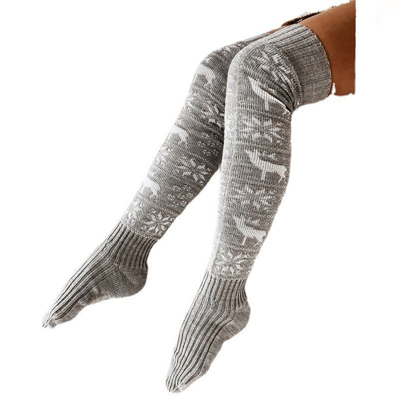 Gray acrylic knit over-the-knee stockings with white reindeer and snowflake pattern.